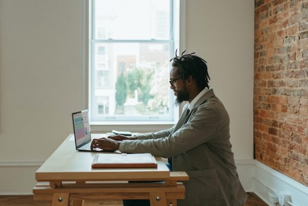 a man on a laptop navigating freelance writing platforms